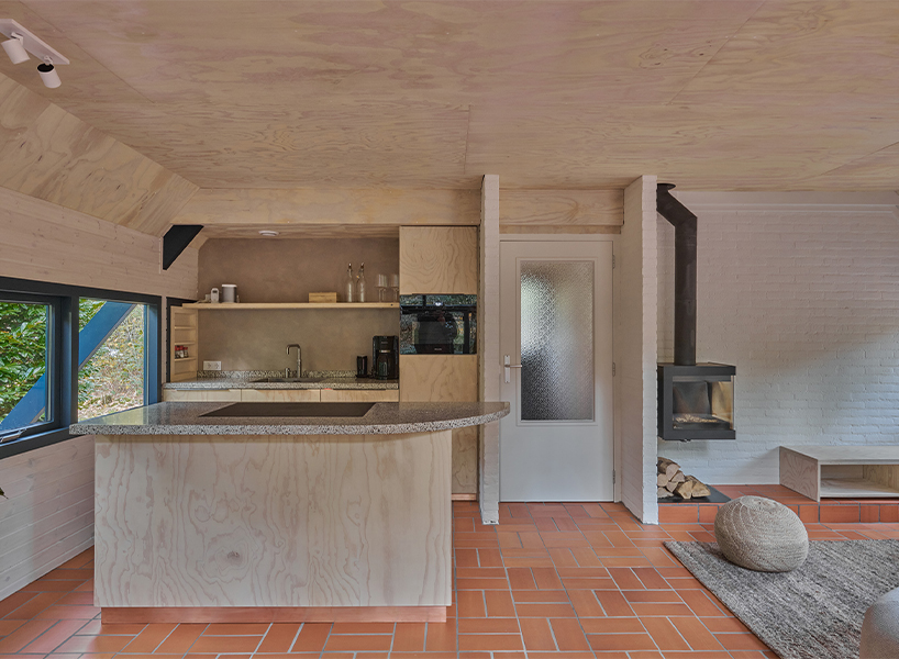 diagonally cut A-frame roof revives dutch holiday home by kumiki