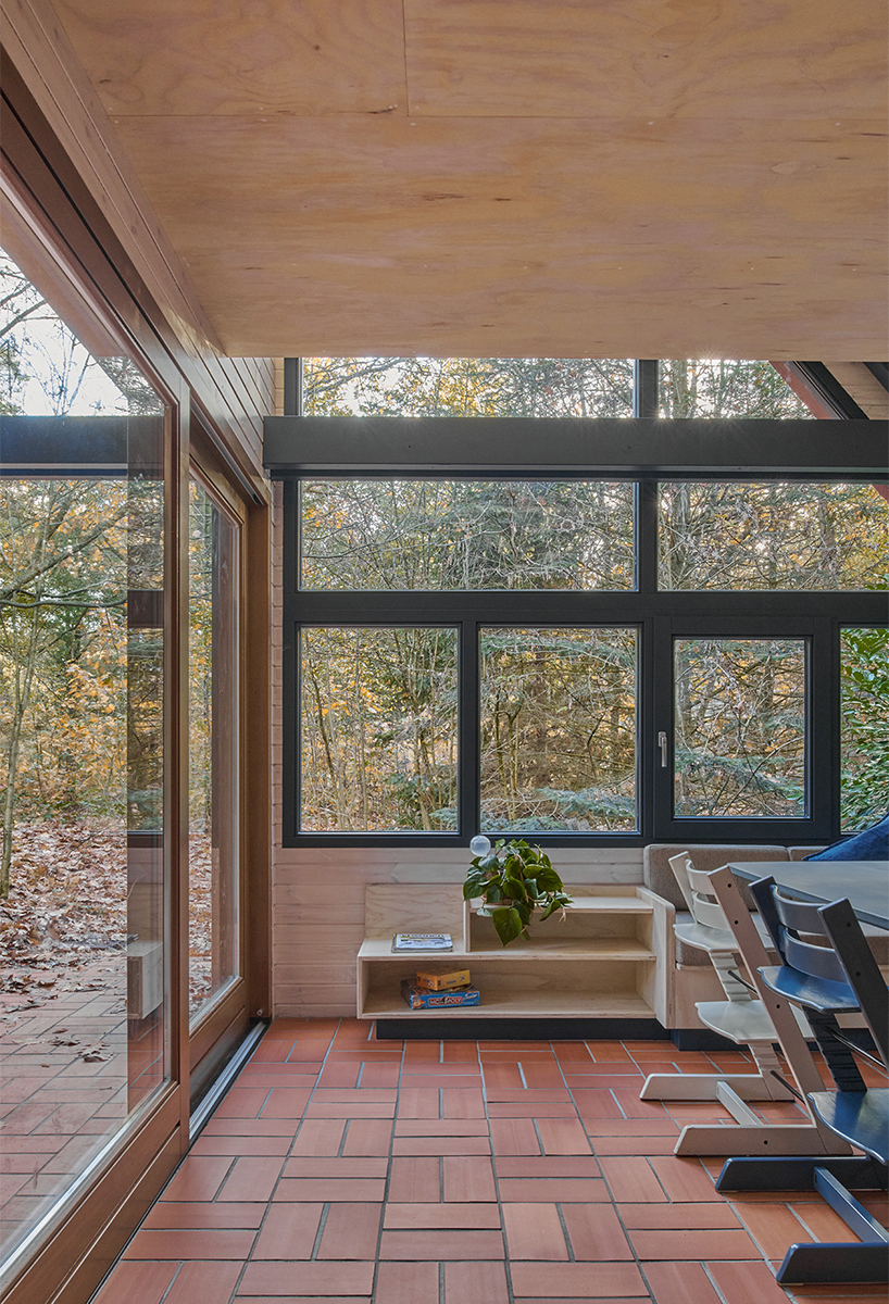 diagonally cut A-frame roof revives dutch holiday home by kumiki