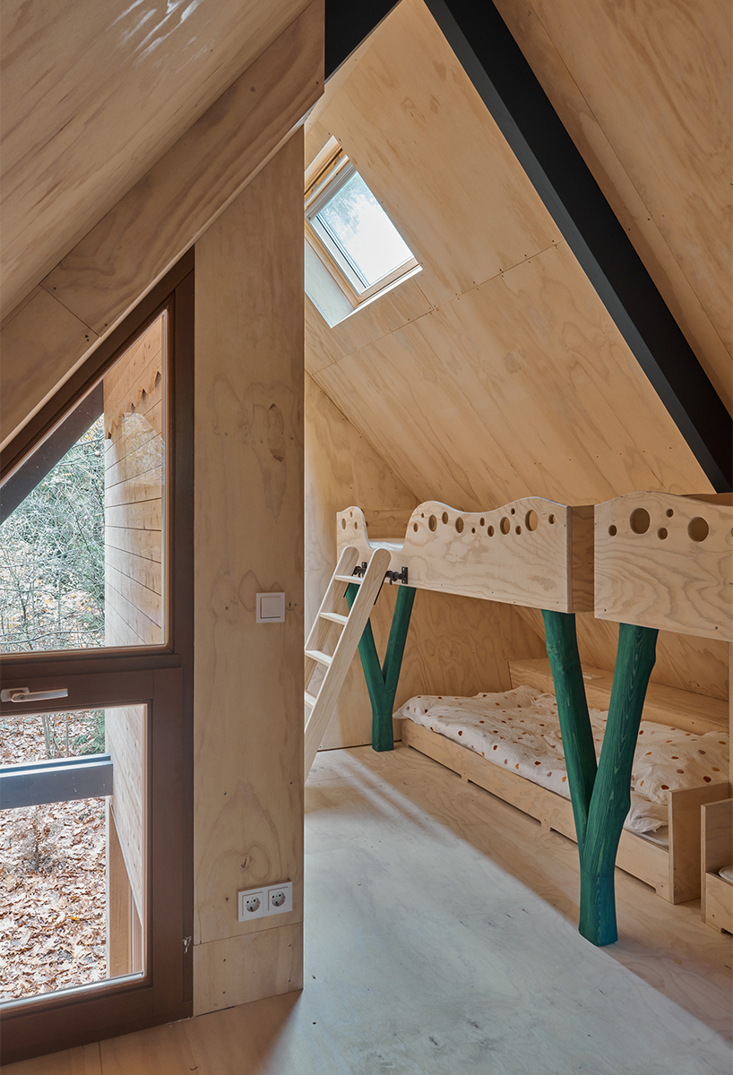 diagonally cut A-frame roof revives dutch holiday home by kumiki