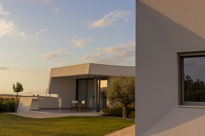 villa gel in cyprus outlines a curvilinear layout that fuses with the greenery