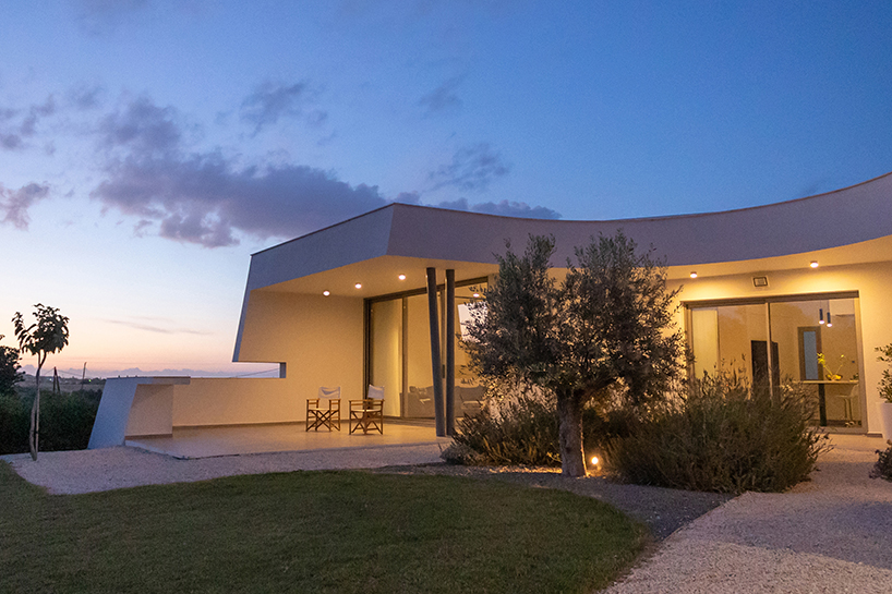 villa gel in cyprus outlines a curvilinear layout that fuses with the greenery