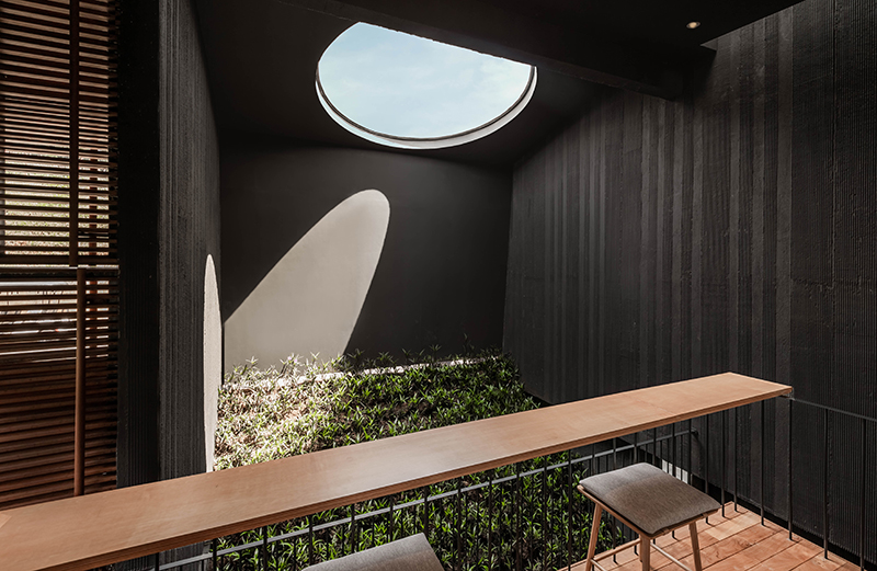 dark monolithic angular volumes shape jae haala villa in indonesia