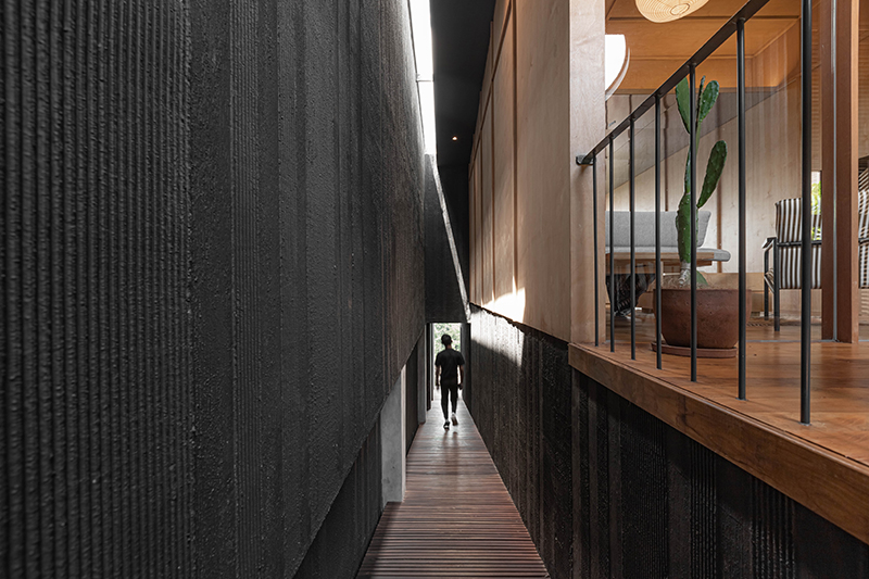 dark monolithic angular volumes shape jae haala villa in indonesia