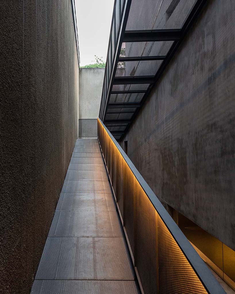 concrete breezeblocks clad residence's facade by wiyoga nurdiansyah architects