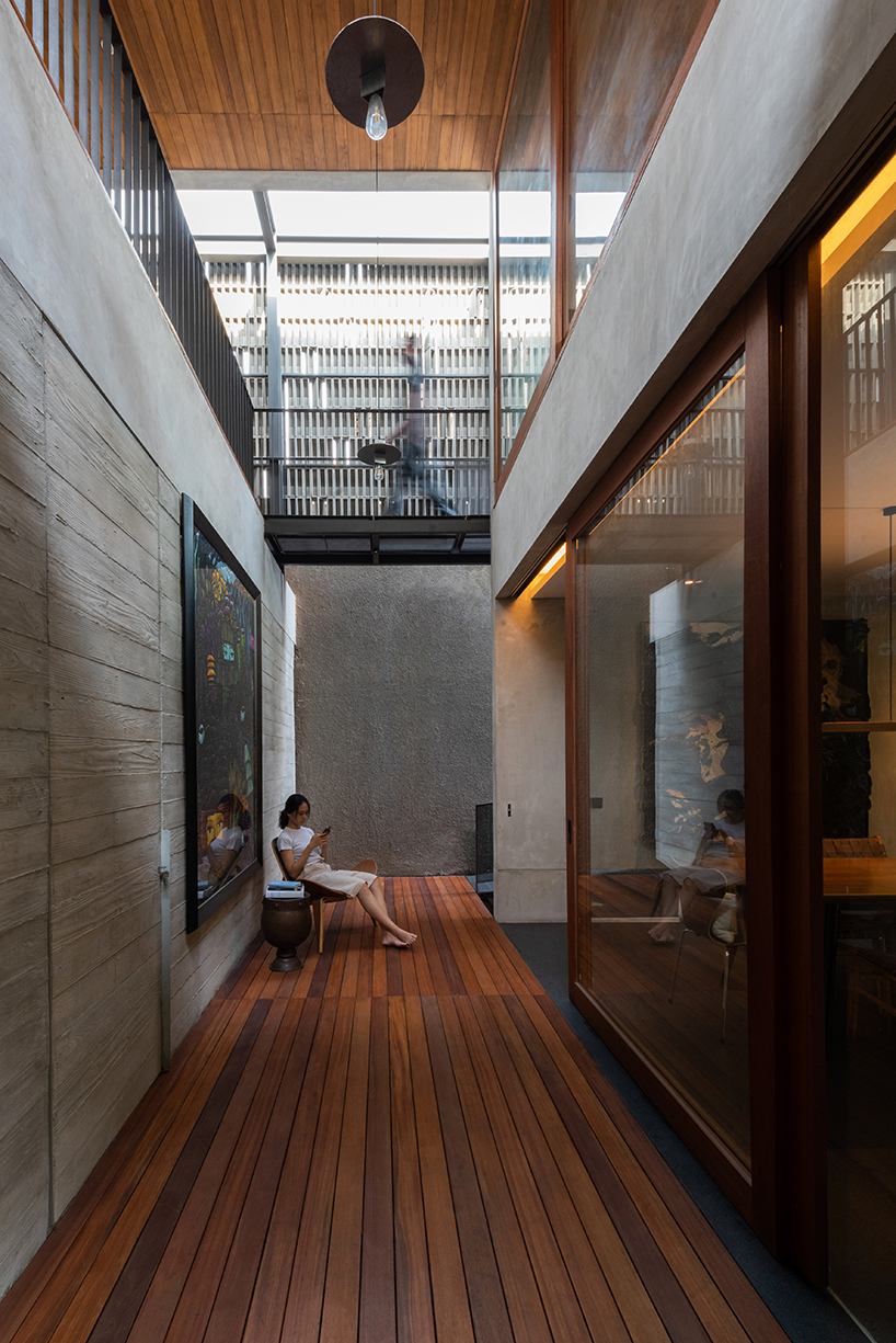 concrete breezeblocks clad residence's facade by wiyoga nurdiansyah architects