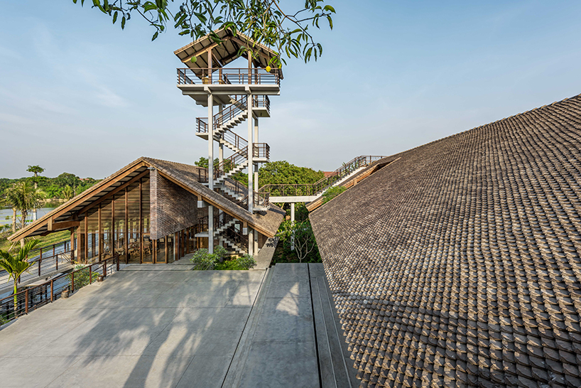raised CHP getaway house stands on stilts above sloping terrain in vietnam