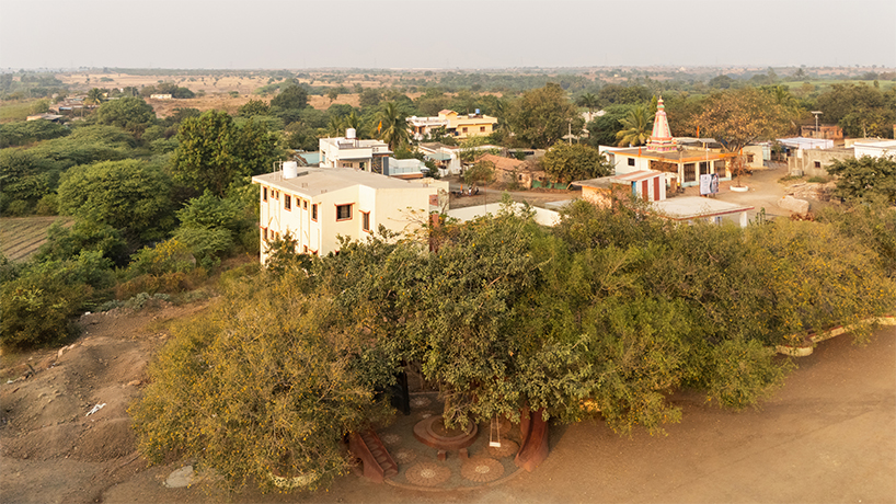 pod for happiness sculpts curving play area around banyan tree in indian school campus