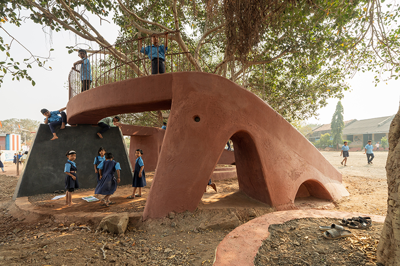 pod for happiness sculpts curving play area around banyan tree in indian school campus