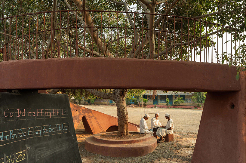 pod for happiness sculpts curving play area around banyan tree in indian school campus