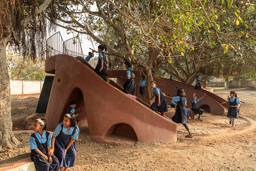 pod for happiness sculpts curving play area around banyan tree in indian school campus