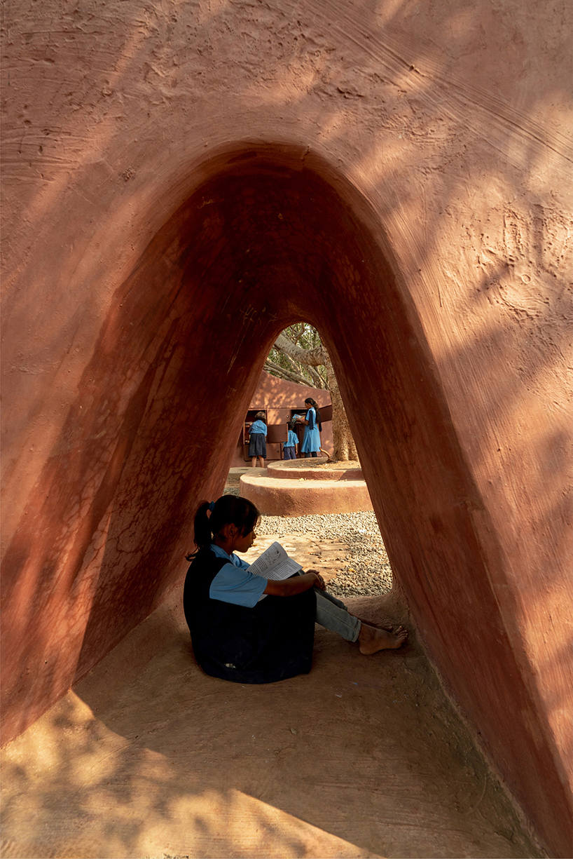 pod for happiness sculpts curving play area around banyan tree in indian school campus