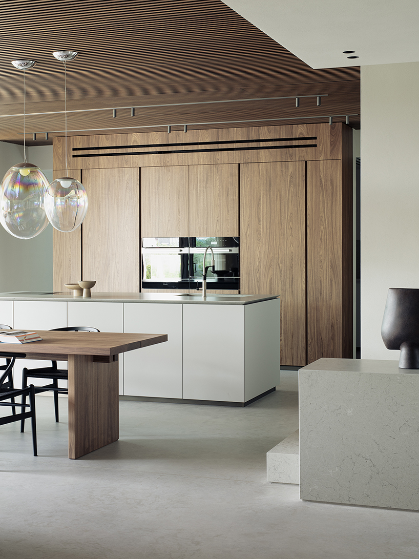 stone walls and warm wooden features adorn private residence in northern italy