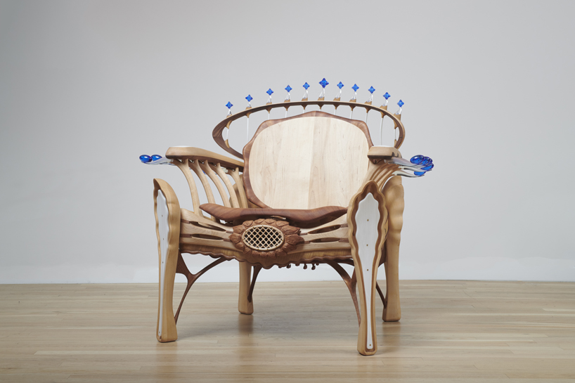 cosmos chair's peculiar design reflects our universe through wooden halos and glass stars