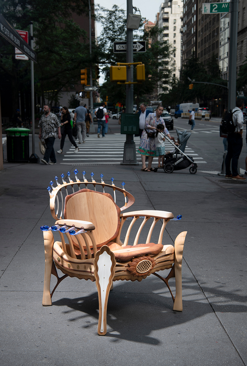 cosmos chair's peculiar design reflects our universe through wooden halos and glass stars