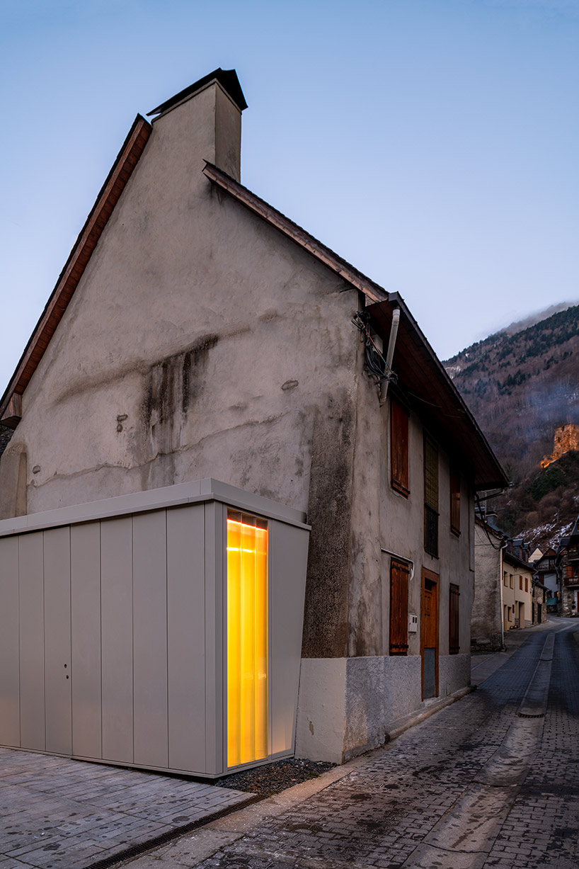 haro museum's translucent openings illuminate the square of val d'aran in spain