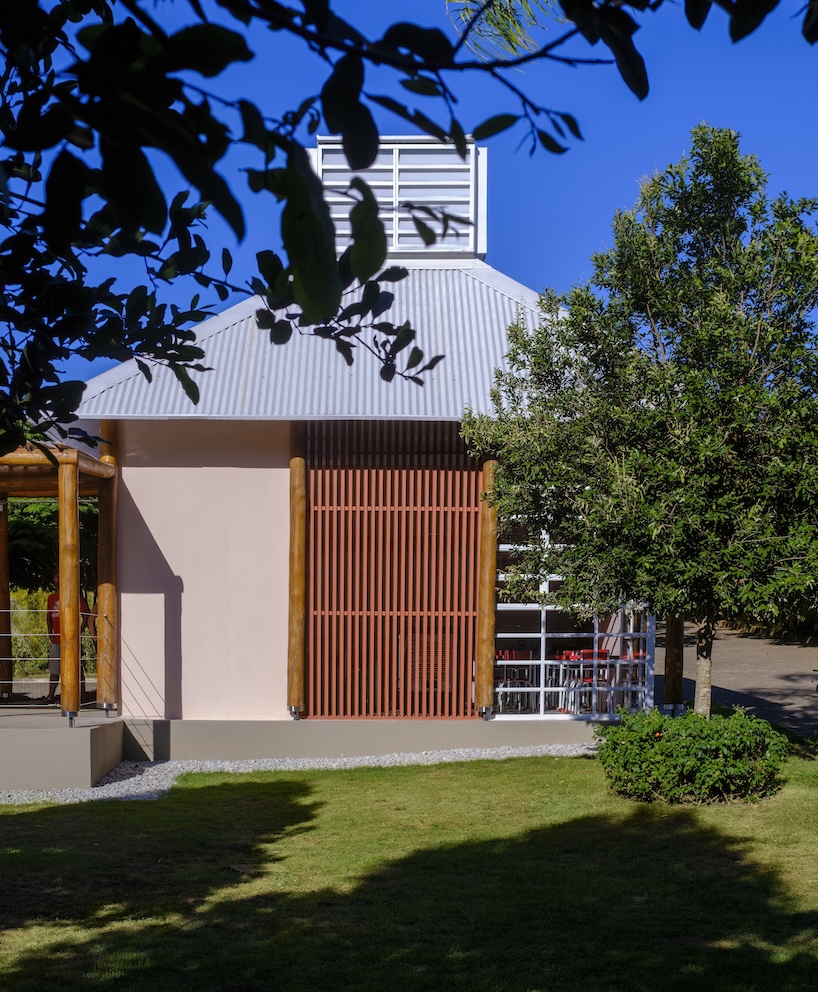 Open classroom surrounded by trees at Vila Ninho school