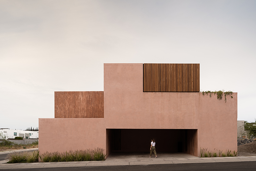 jorge garibay configures brutalist house in mexico as tetris-like pink concrete volumes