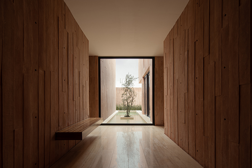 jorge garibay configures brutalist house in mexico as tetris-like pink concrete volumes
