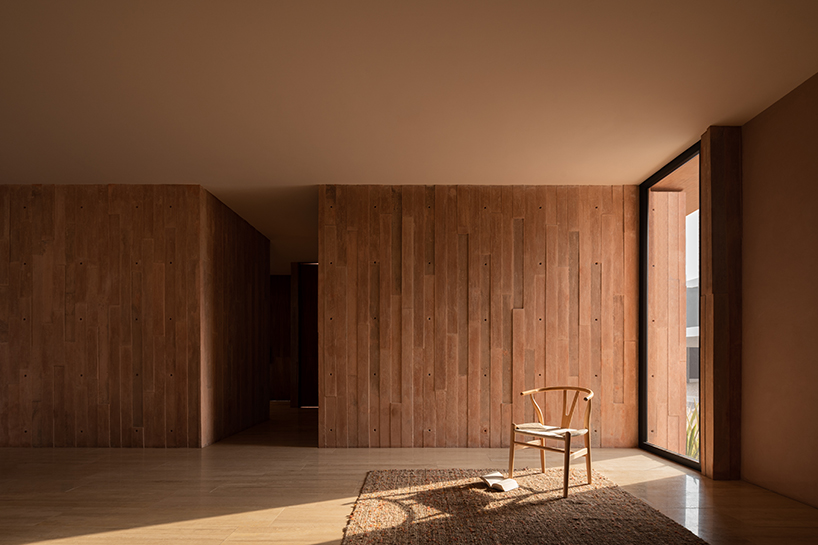 jorge garibay configures brutalist house in mexico as tetris-like pink concrete volumes