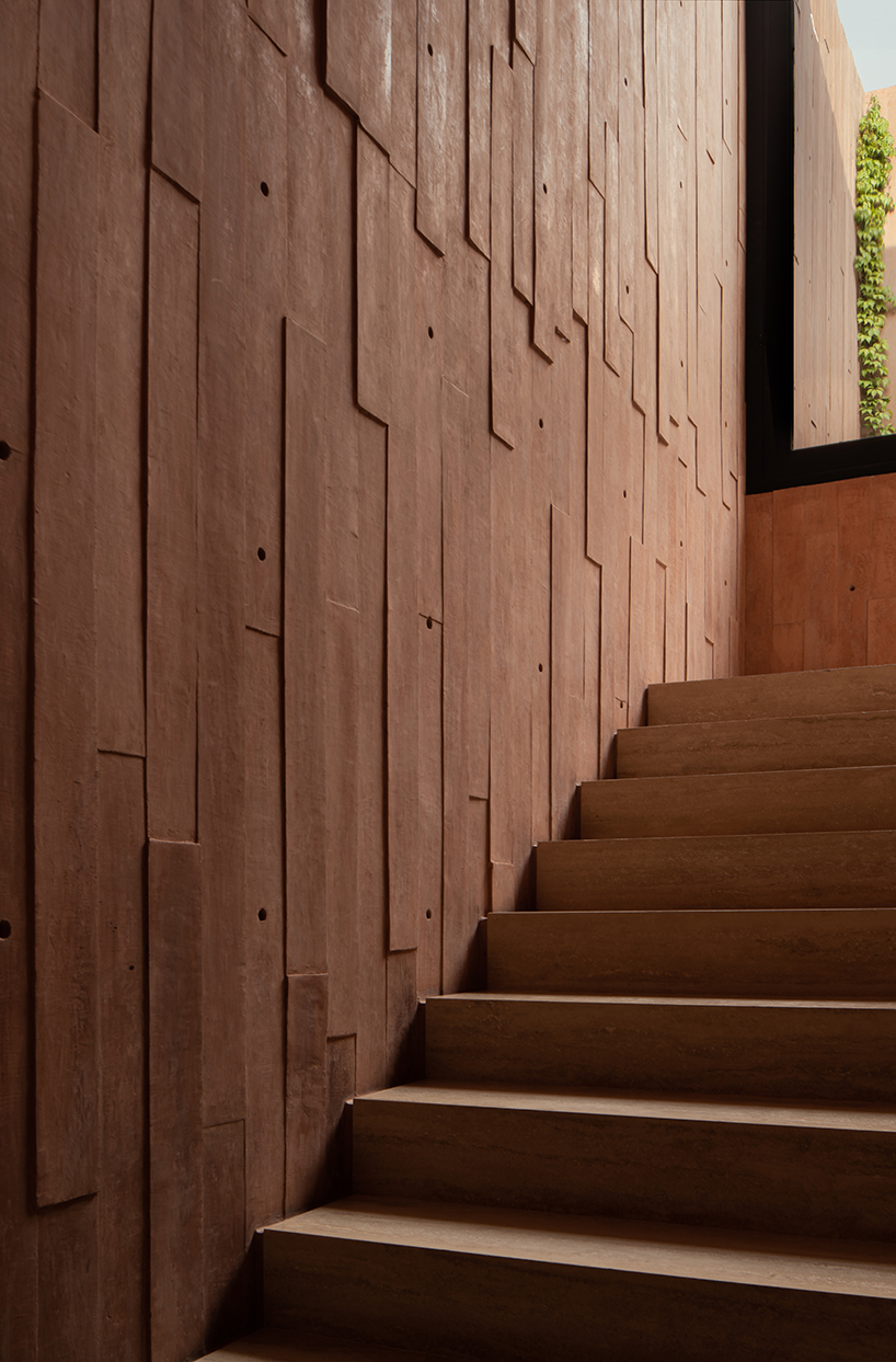 jorge garibay configures brutalist house in mexico as tetris-like pink concrete volumes