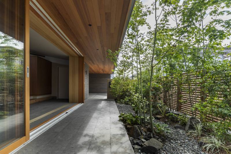 black cedar and stone flooring adorn minimal residence in japan