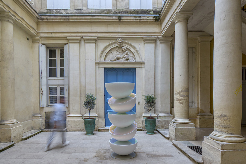 vicente spínola's totem installation stacks reflective semi-spheres, pondering the climate crisis