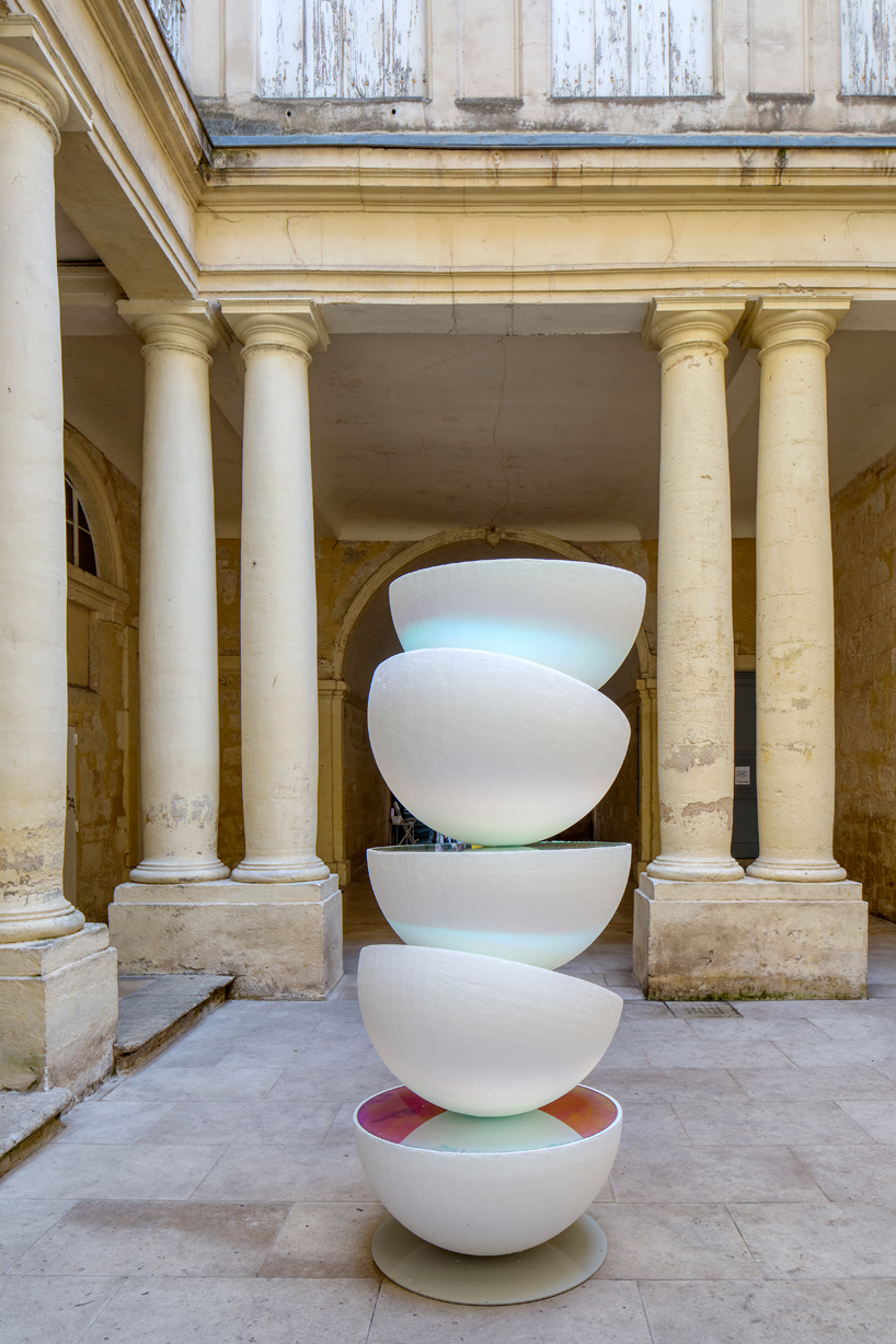 vicente spínola's totem installation stacks reflective semi-spheres, pondering the climate crisis
