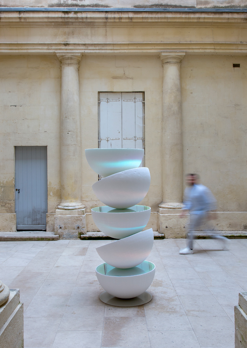 vicente spínola's totem installation stacks reflective semi-spheres, pondering the climate crisis