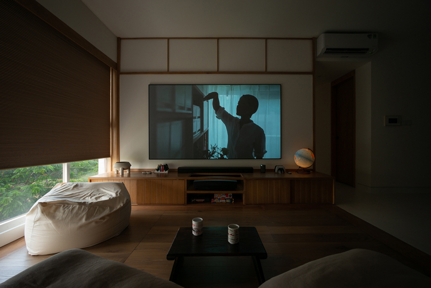 H3D7 apartment in vietnam sets up a wooden framework shaping multifunctional rooms