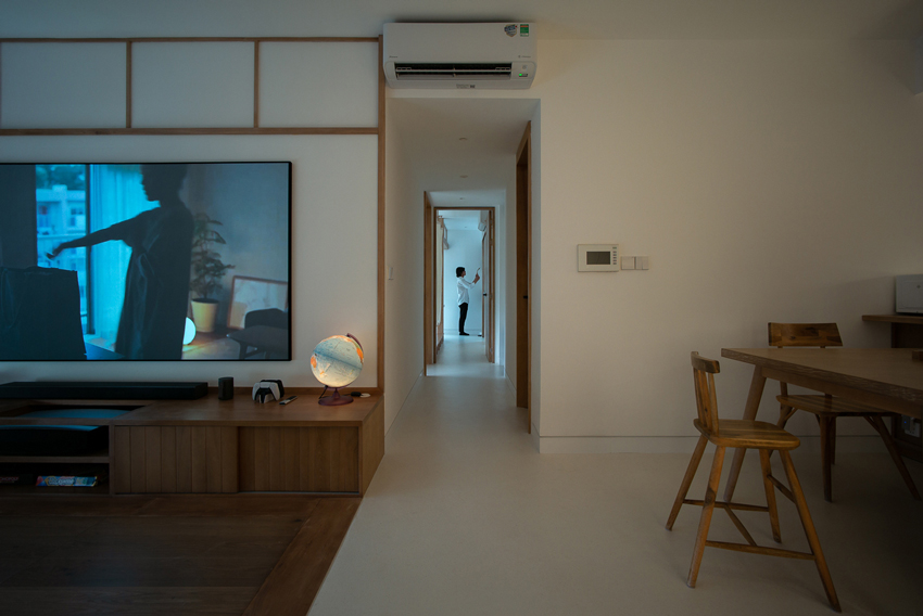 H3D7 apartment in vietnam sets up a wooden framework shaping multifunctional rooms