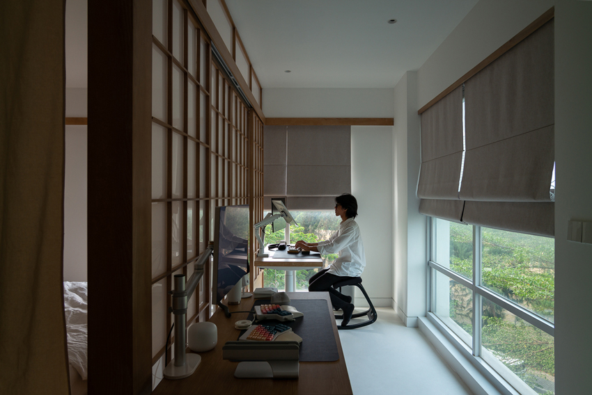 H3D7 apartment in vietnam sets up a wooden framework shaping multifunctional rooms