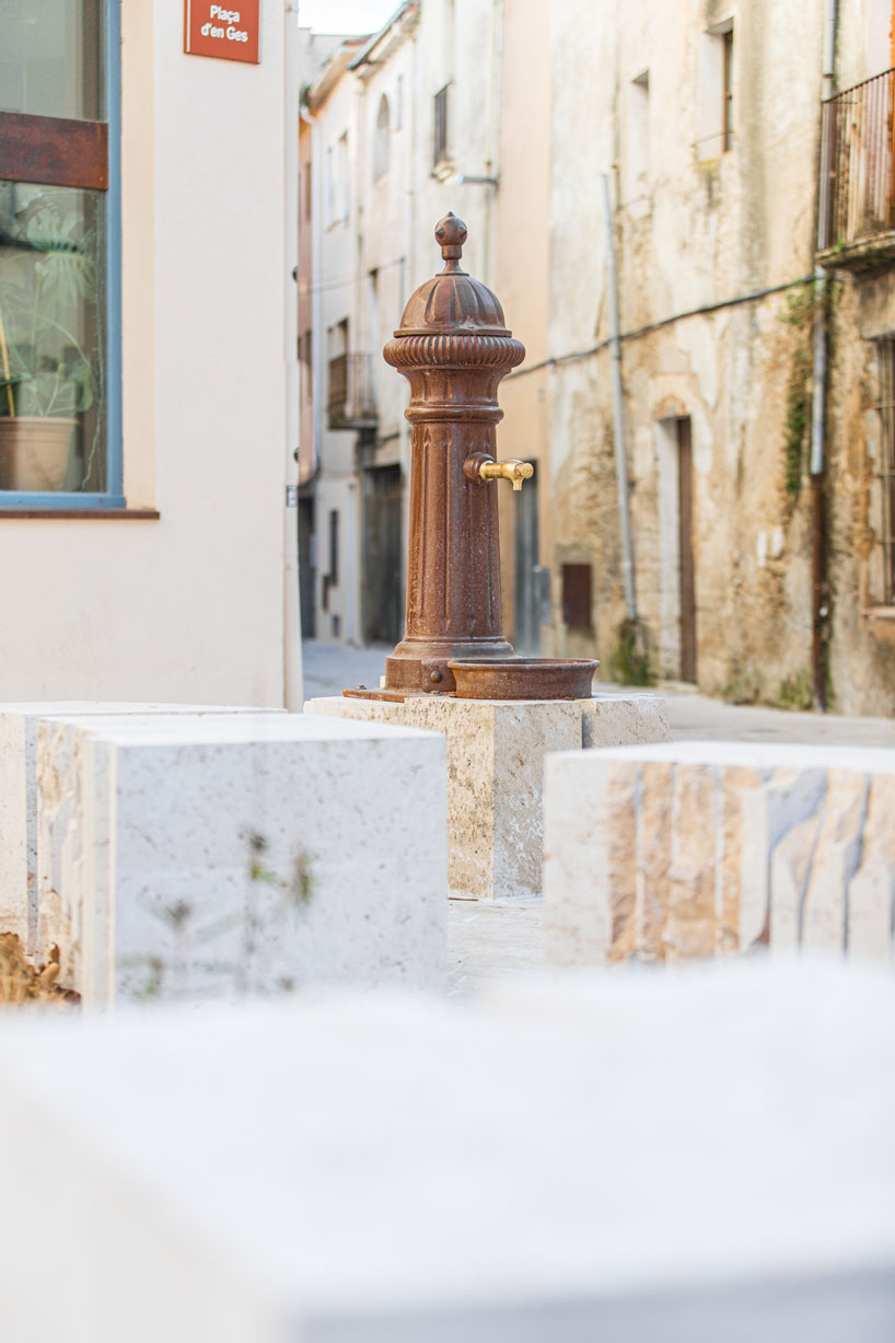 carved travertine transforms paving, furniture, and planting across spanish historic old town - 6