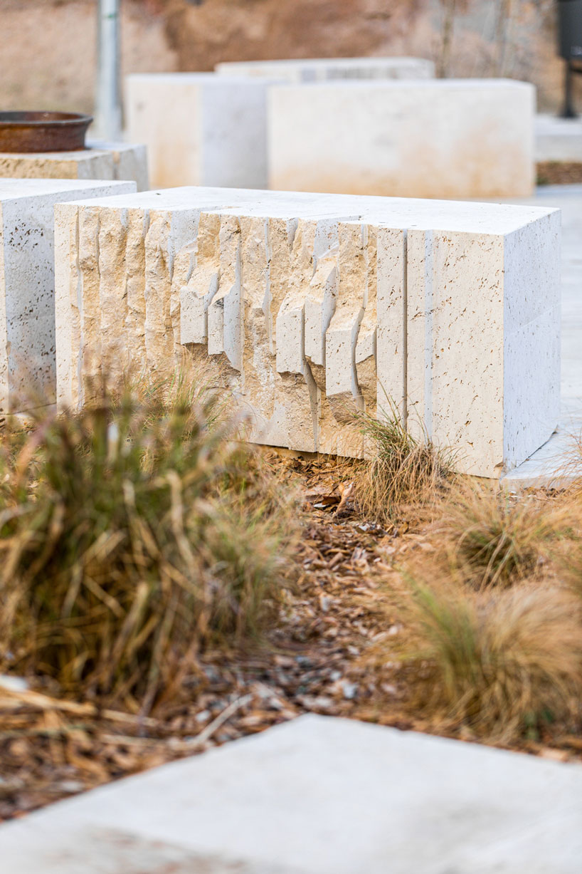 carved travertine transforms paving, furniture, and planting across spanish historic old town - 7