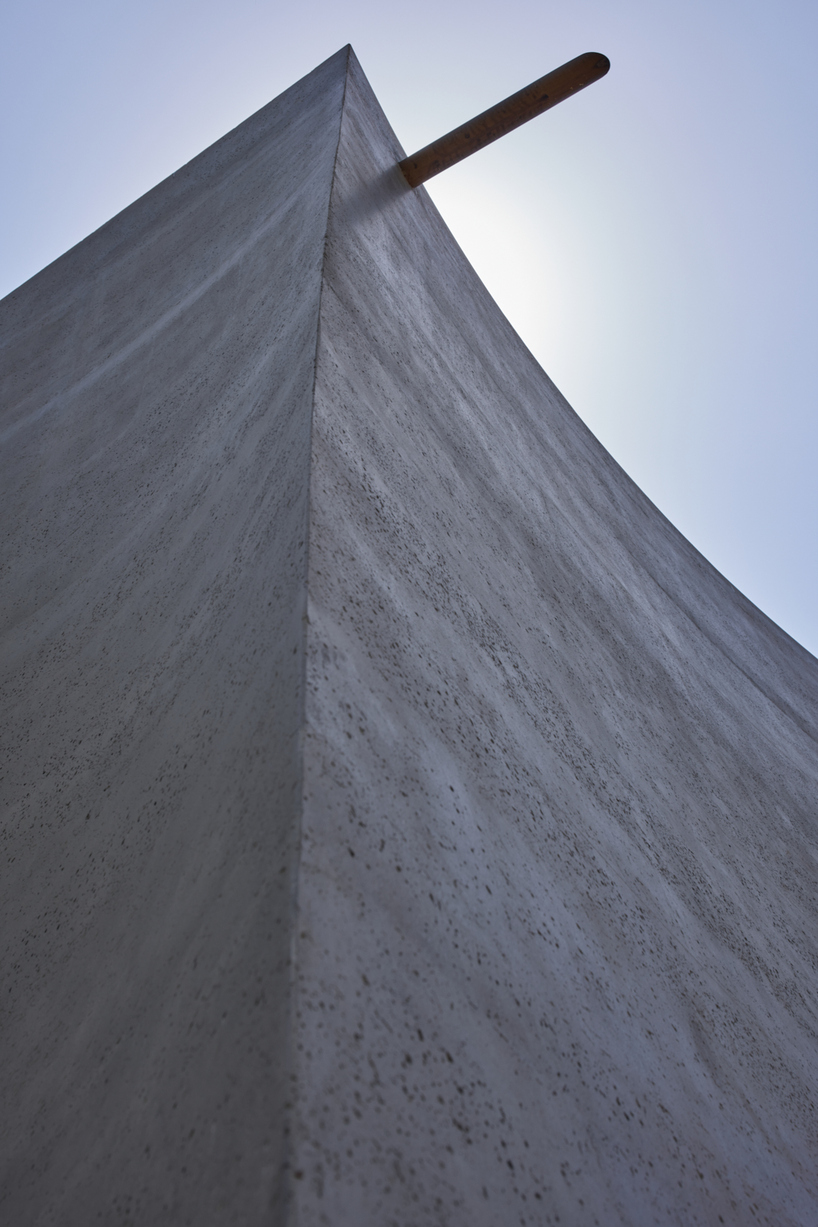 monolithic chapel in south korea explores concrete's properties and nature's organic forms