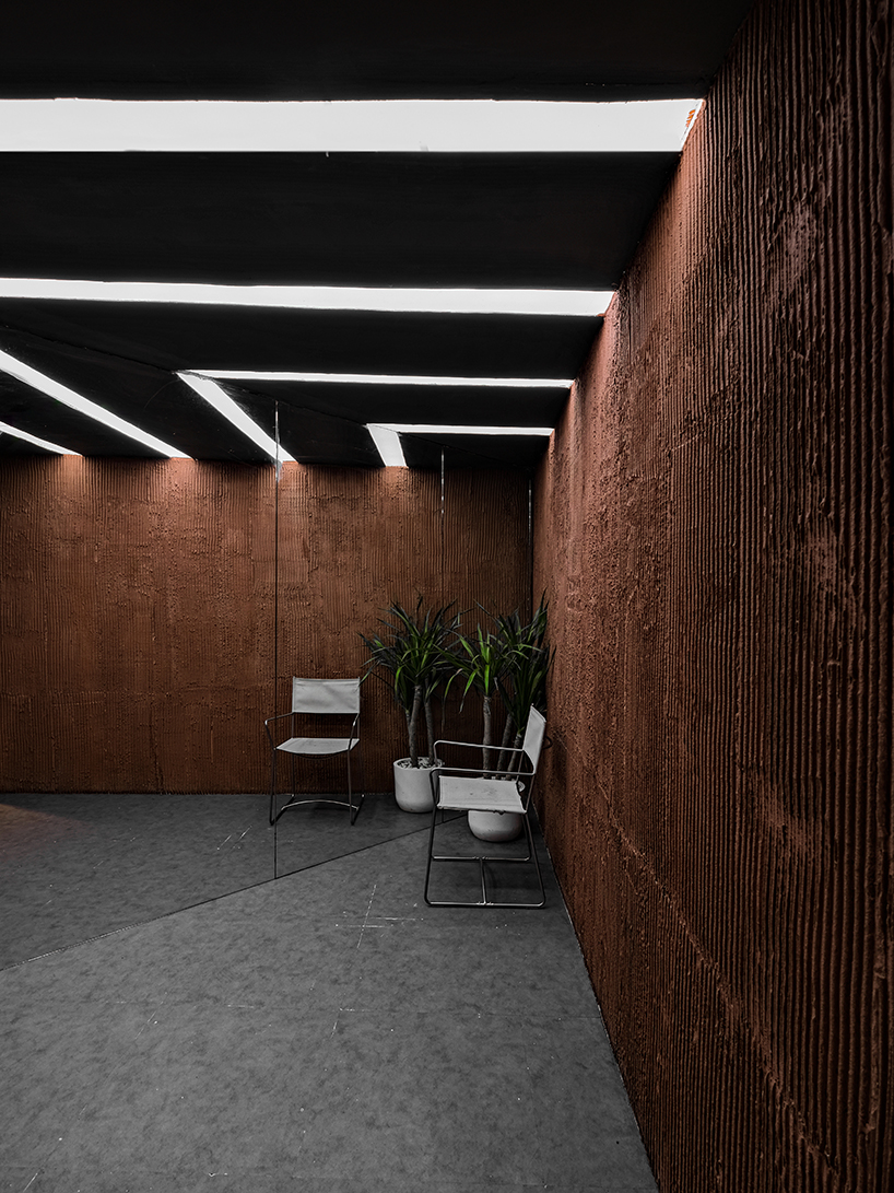 terracotta-tinted concrete district 27 coffee shop reuses old medical laboratory in indonesia