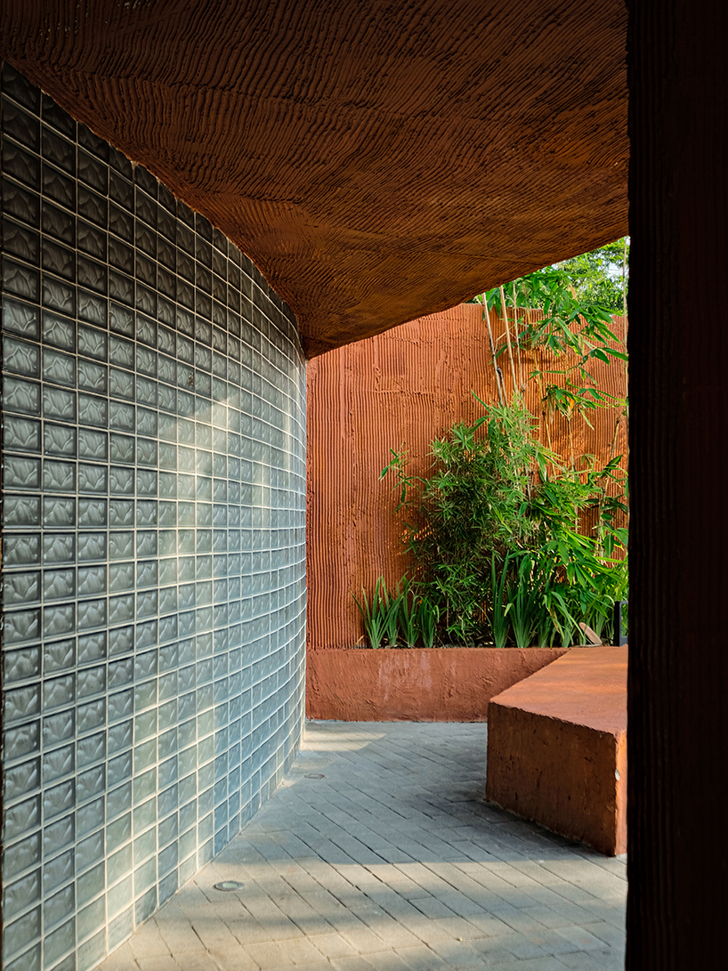 Concrete coffee shop with terracotta shades 27 coffee reuses the old medical laboratory in Indonesia