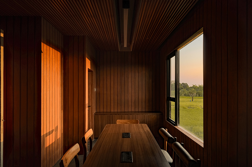 local stone, brick and terracotta screens layer across three-story gathering space in indonesia - 10