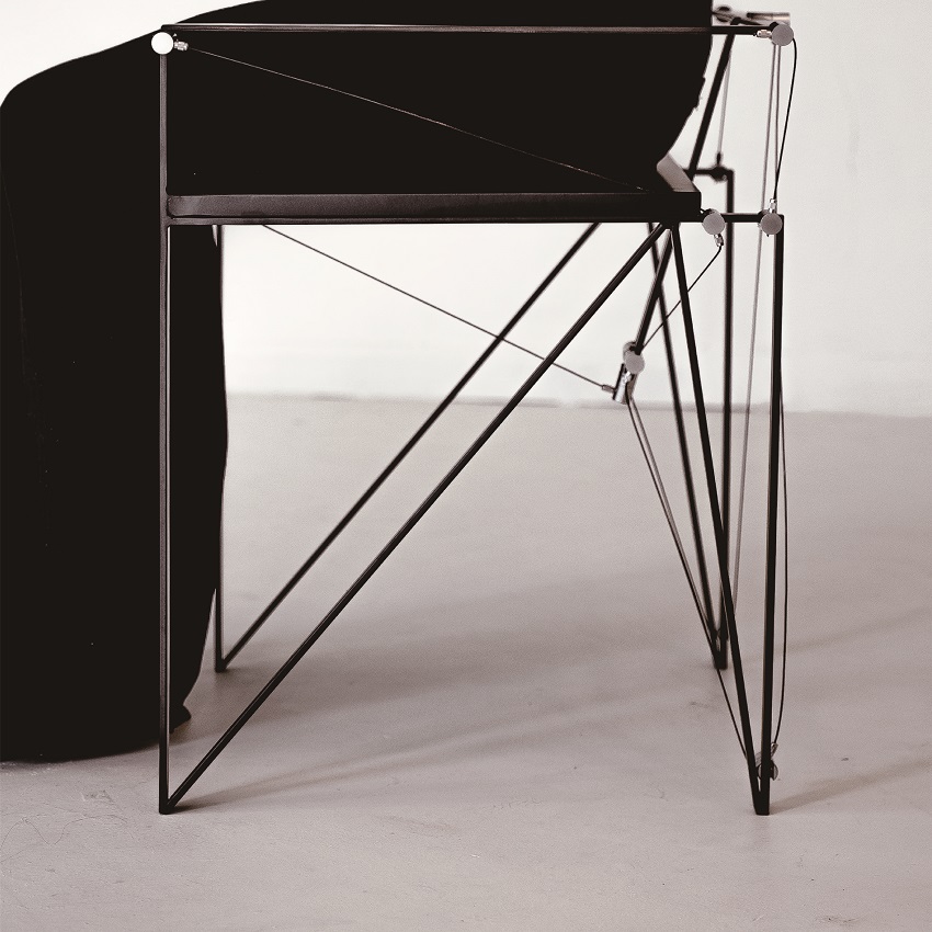 furniture series explores tension and balance through sleek austere aesthetics