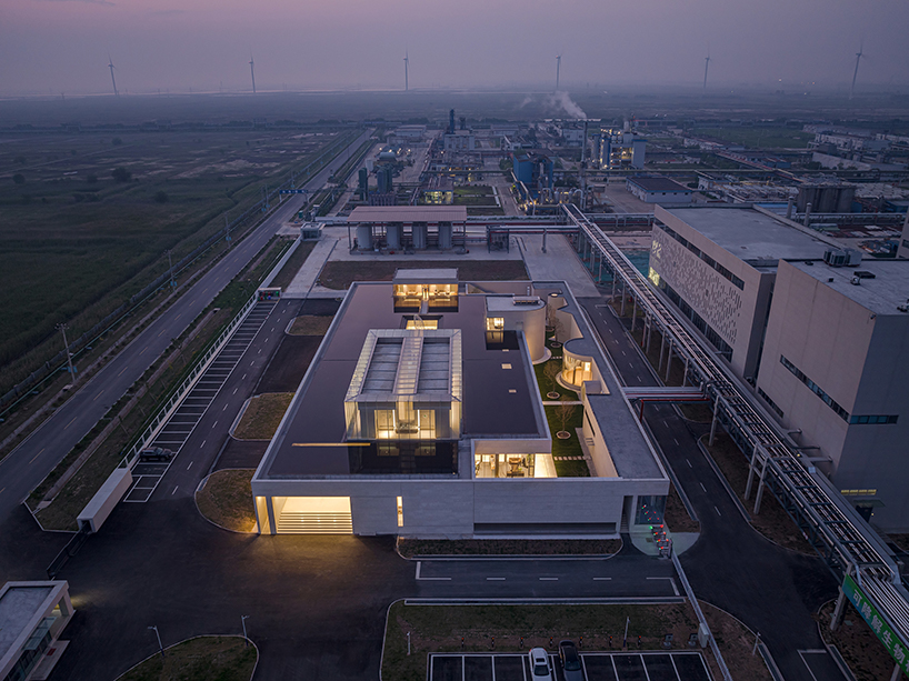 biomanufacturing facility by xing design lies under shallow water ponds in china