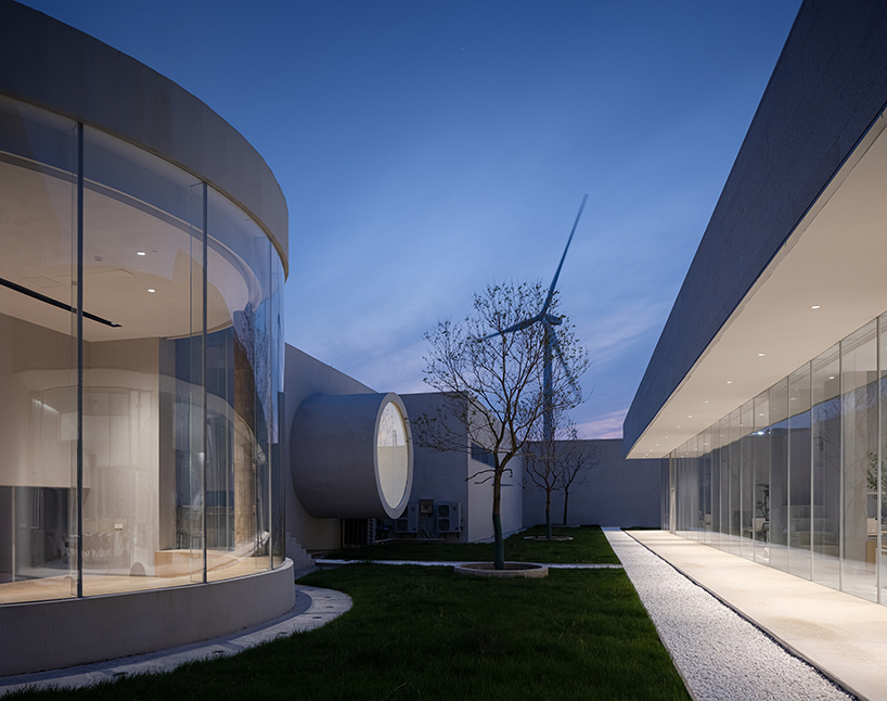 biomanufacturing facility by xing design lies under shallow water ponds in china