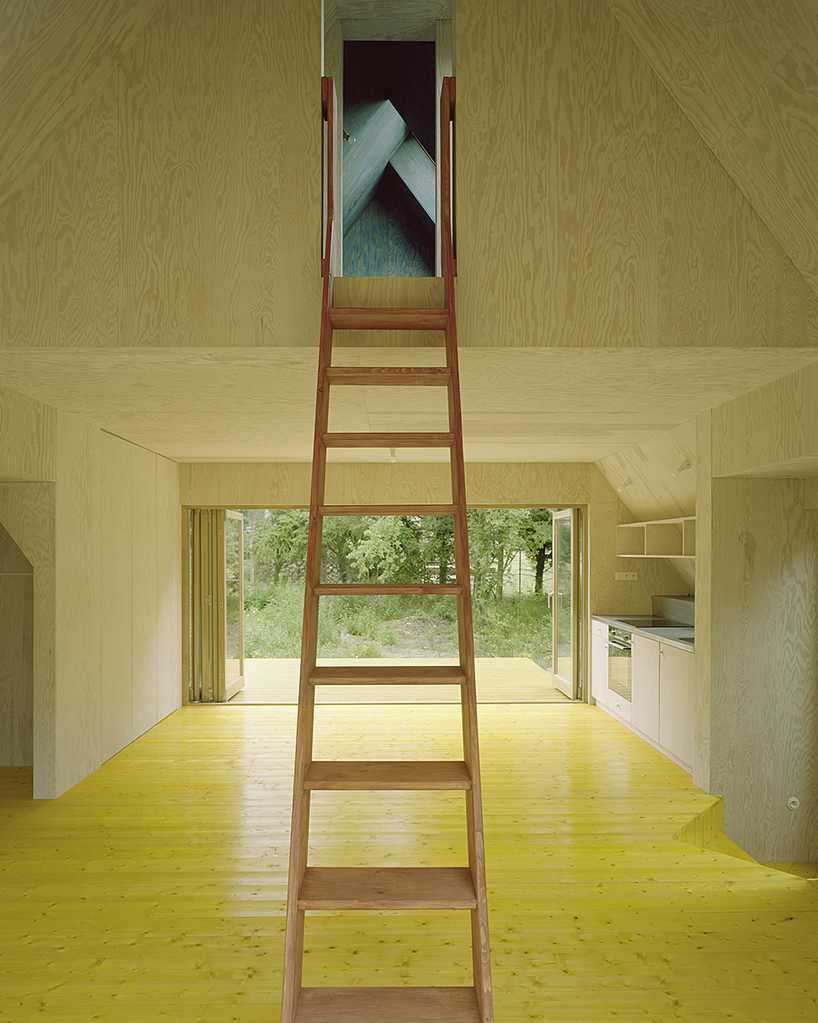 primary colors imbue the wooden A-frame house wolin in poland