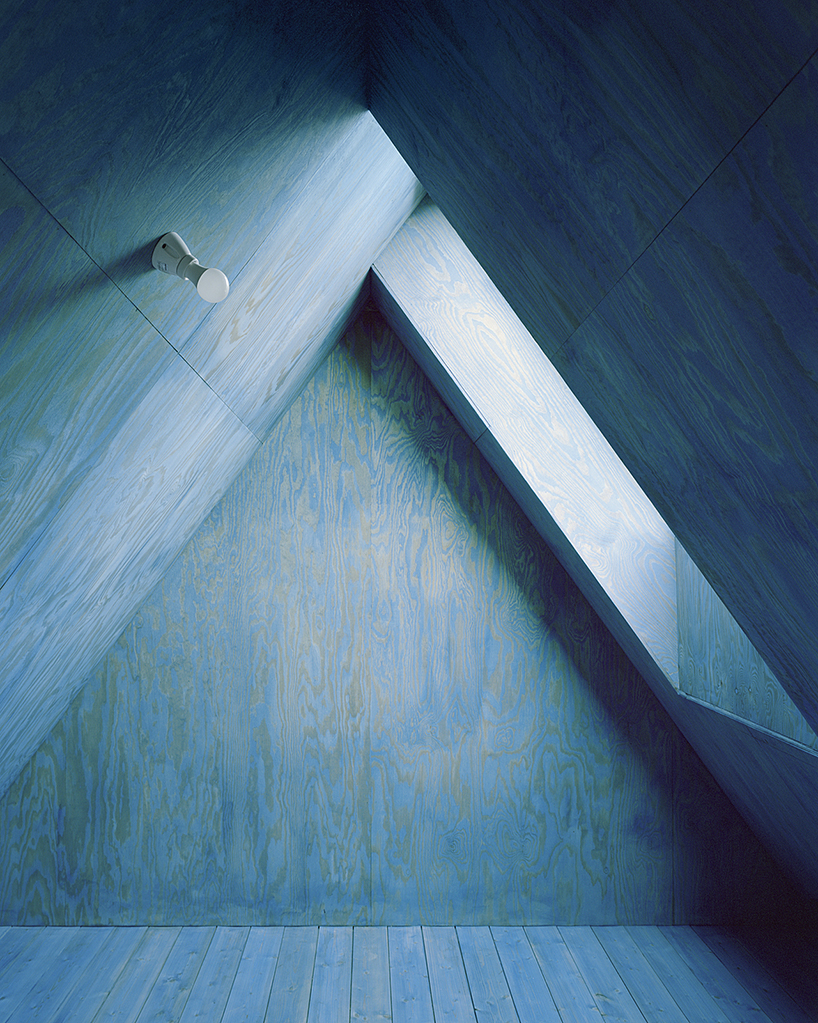 primary colors imbue the wooden A-frame house wolin in poland