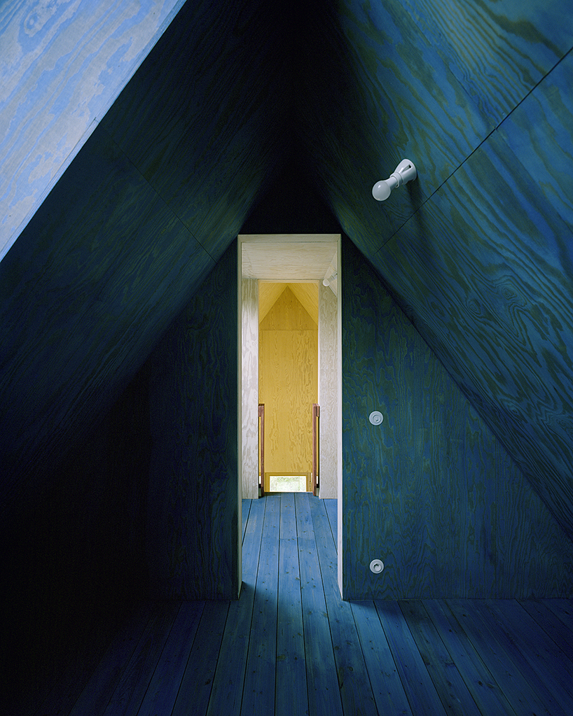 primary colors imbue the wooden A-frame house wolin in poland