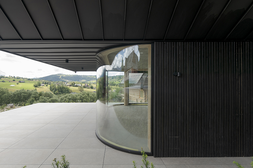 steep-sloped metal roofs crown residential units in poland resembling nest boxes