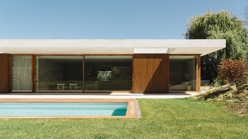 two concrete planes cantilever above the living zones of hara house in bilbao