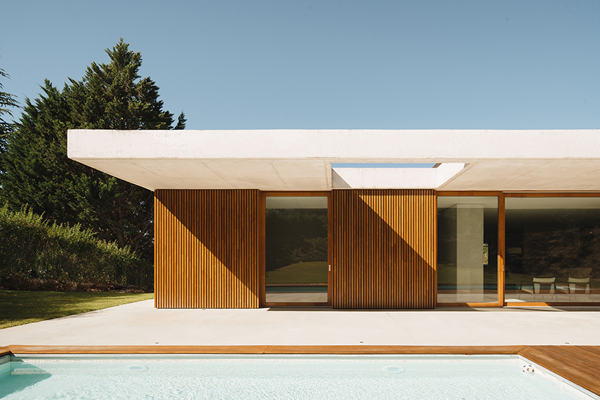 two concrete planes cantilever above the living zones of hara house in bilbao