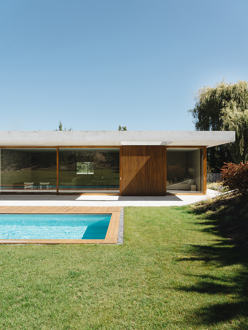 two concrete planes cantilever above the living zones of hara house in bilbao