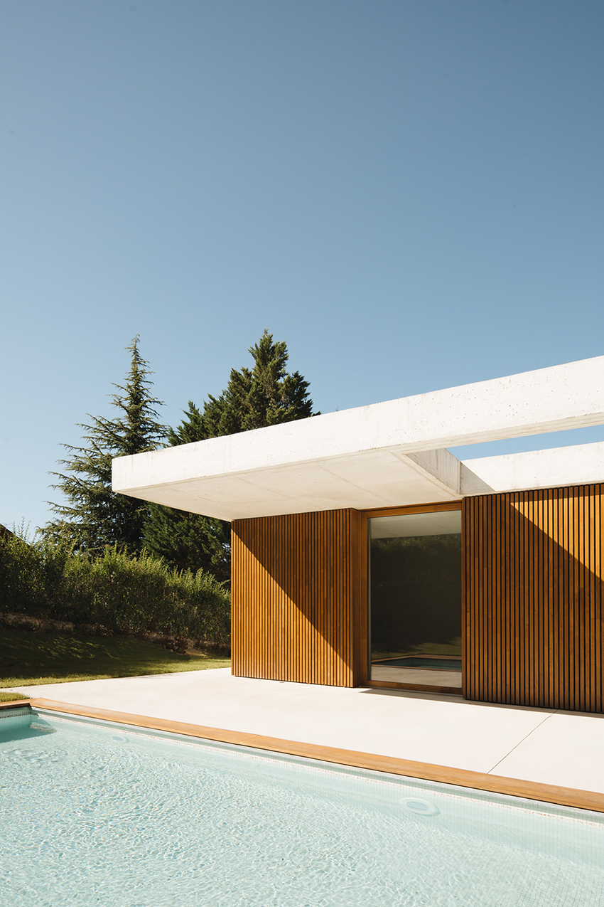 two concrete planes cantilever above the living zones of hara house in bilbao