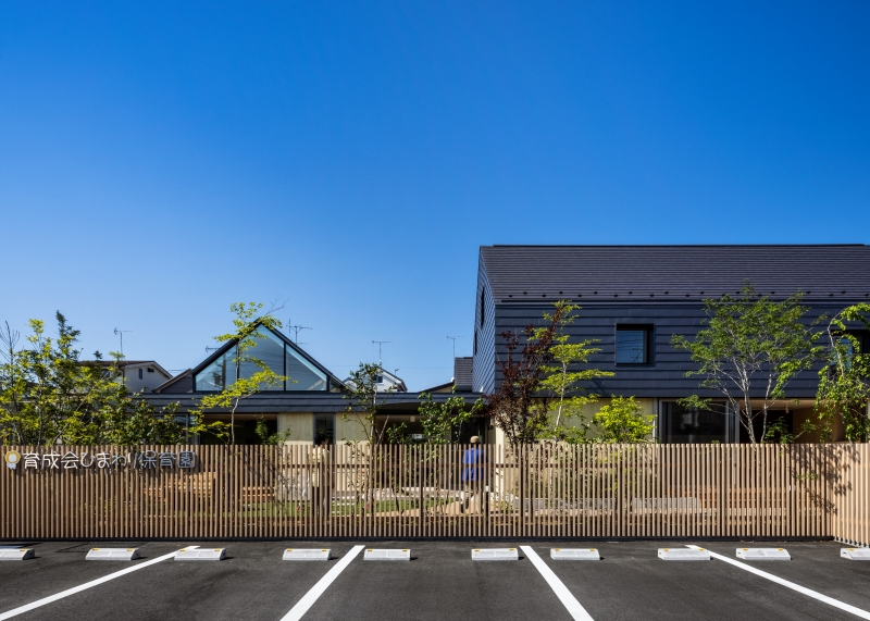 five wooden house-shaped volumes compose himawari nursery school in tokyo