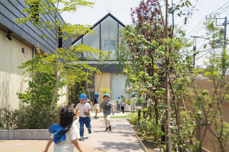 five wooden house-shaped volumes compose himawari nursery school in tokyo